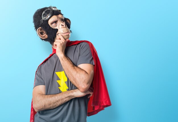 Superhero monkey man thinking on colorful background