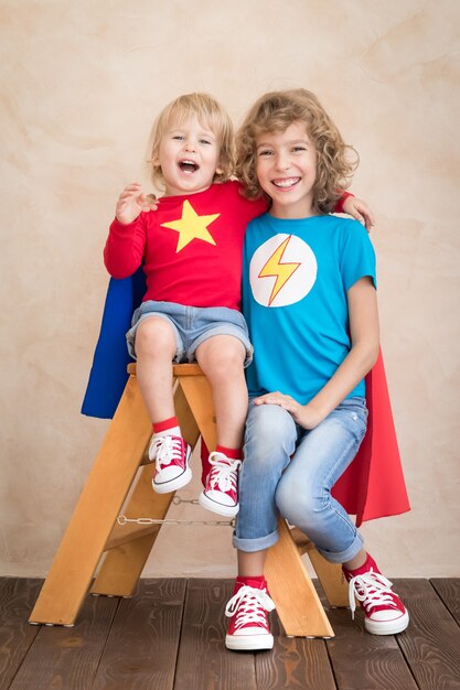 Superheroes children playing at home