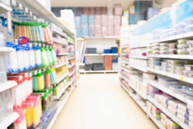 Supermarket aisle with product on shelves abstract blur defocused background