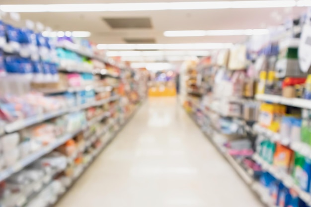 Supermarket aisle with product on shelves blurred background