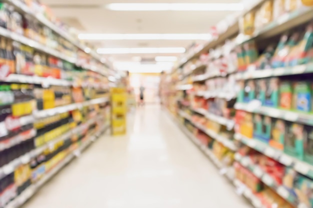 Supermarket aisle with product on shelves blurred background