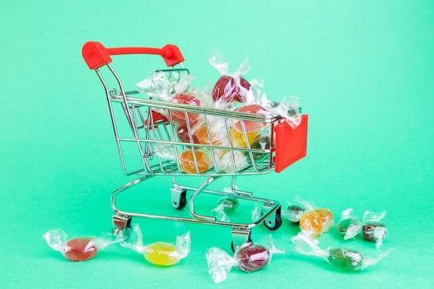 supermarket basket, Inside  multicolored caramel dragees. 