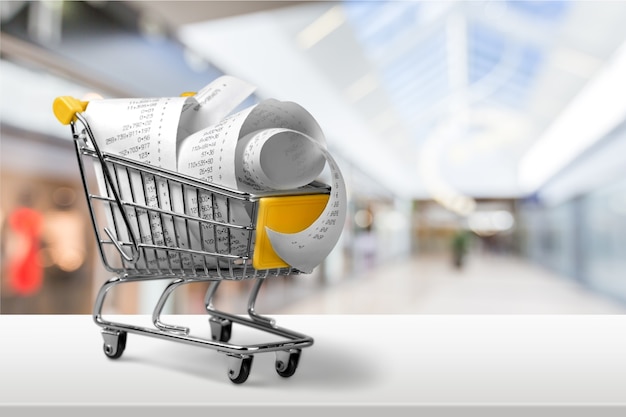 Supermarket check with numbers in shopping cart, close-up view