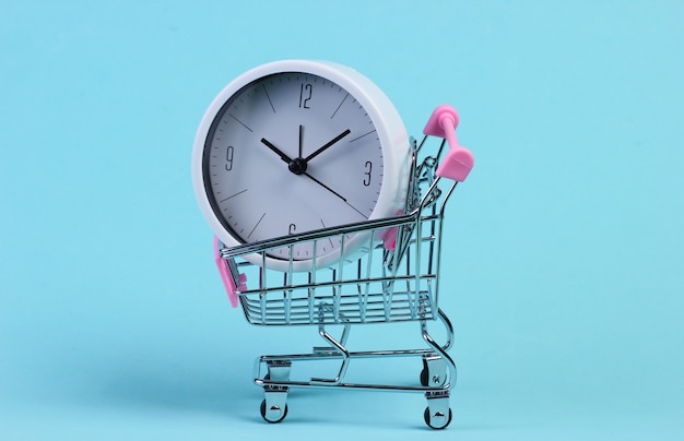 Supermarket trolley with clock on blue