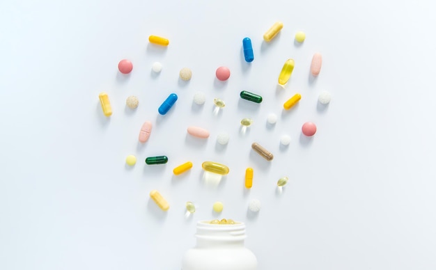 Supplements and vitamins on a white background Selective focus Medicine