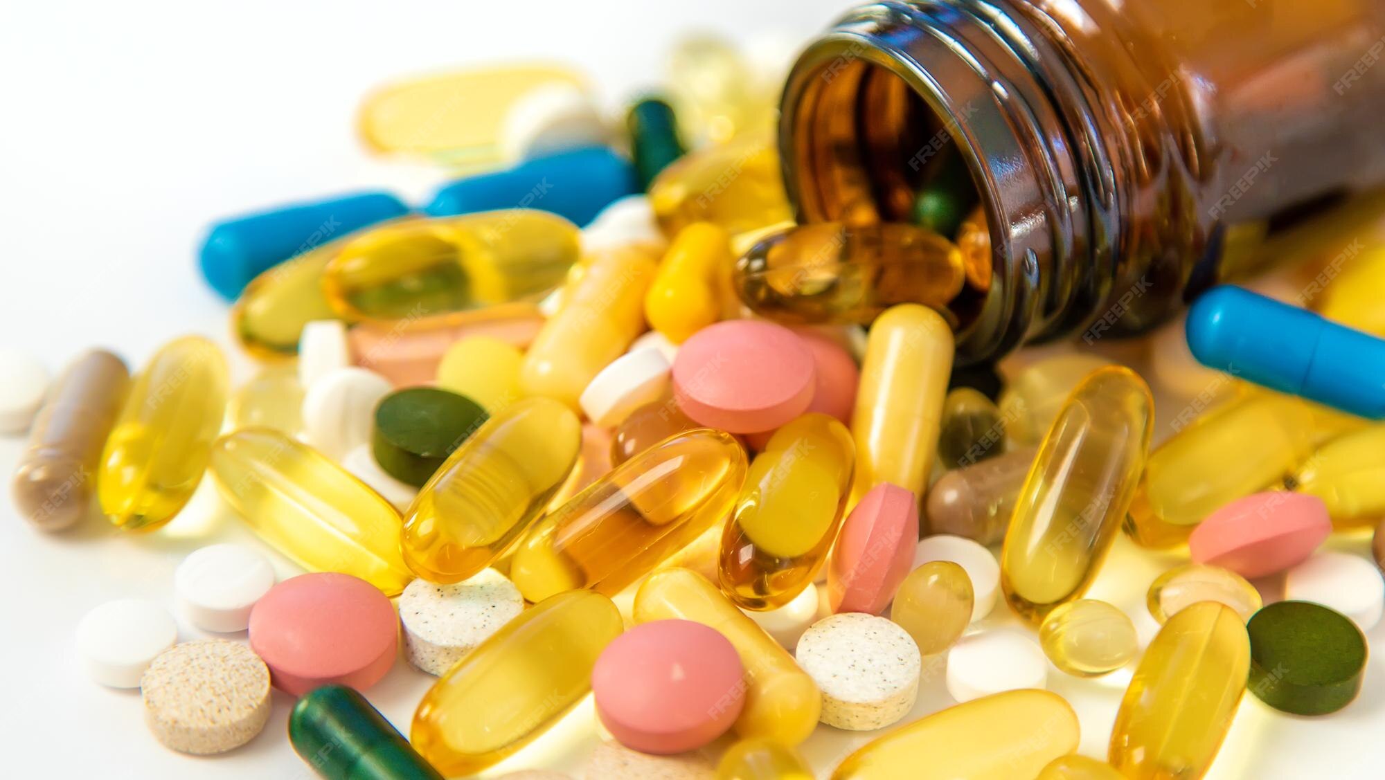 Premium Photo | Supplements and vitamins on a white background selective focus medicine