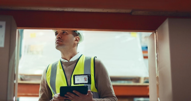 Supply chain tablet and box with man in warehouse for inventory logistics or shipping Export delivery or cargo storage with digital checklist for customs compliance in distribution management