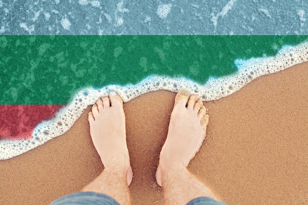 Surf on sandy beach with flag Bulgaria Top view