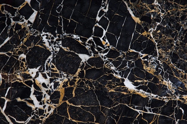 Photo surface of black marble with yellow and white veins