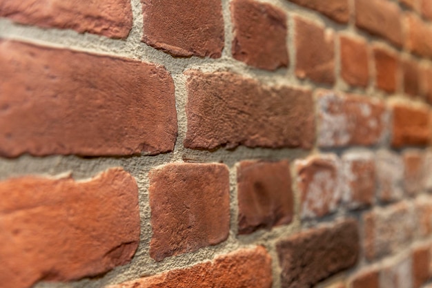 The surface of a brick wall Construction repair and decoration of premises Side view Space for text Background