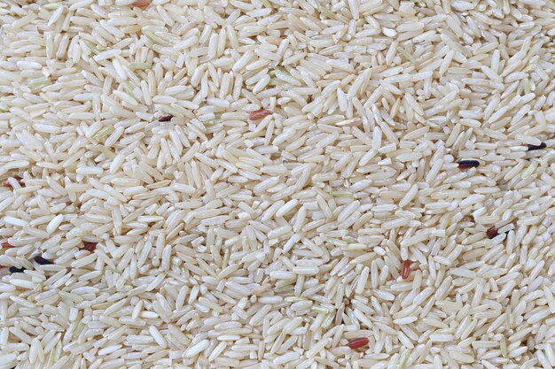 Surface of brown jasmine rice background.