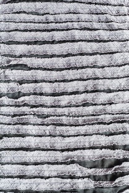 Foto superficie di stoffa cucita da tessuto intagliato