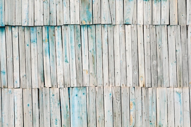 Поверхность серых старых деревянных досок с голубой краской