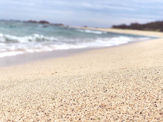 Surface level of beach against sky