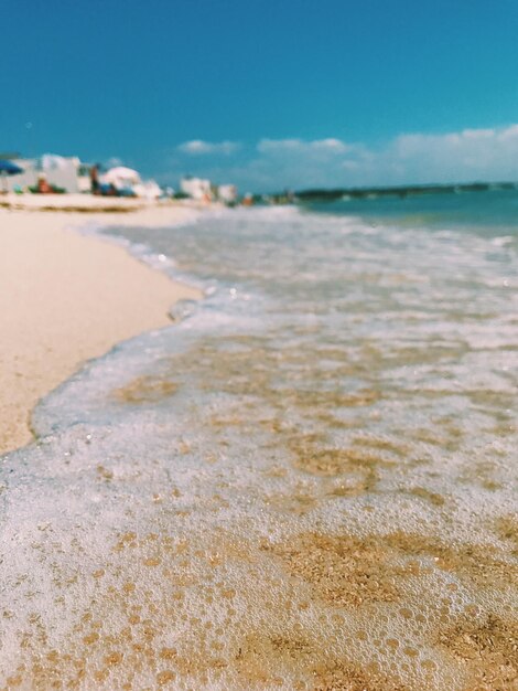 Surface level of beach against sky