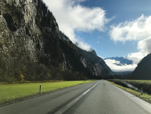 Surface level of empty road against sky