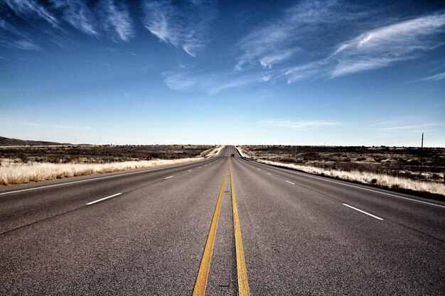 Surface level of empty road along landscape