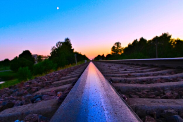 Surface level of railroad track against sky