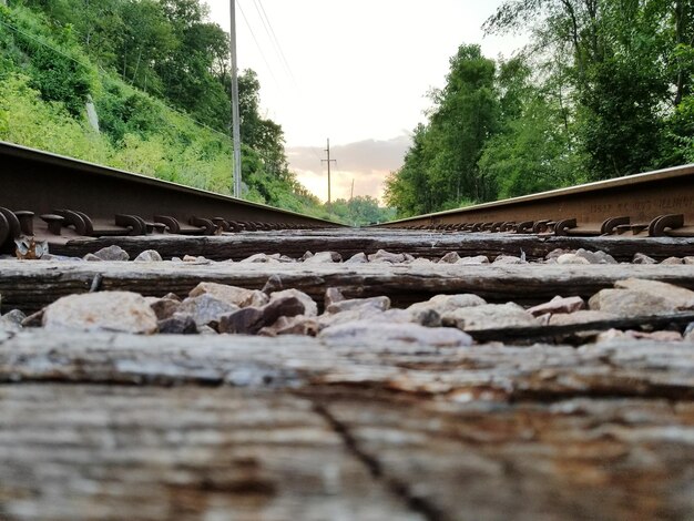 Surface level of railroad track against sky