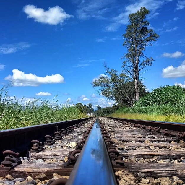 Surface level of railroad track against sky