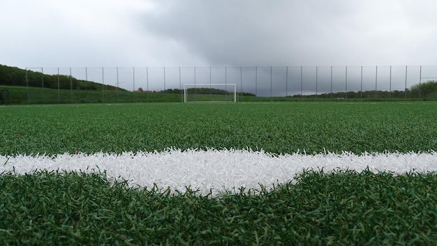 Surface level of soccer field against sky