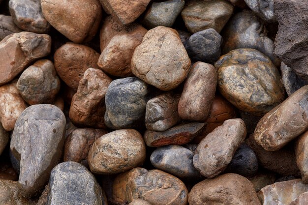 surface of many rough wet stones after rain