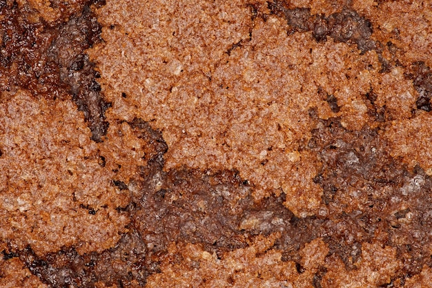 Фото Поверхность шоколадного овсяного печенья на заднем плане крупным планом