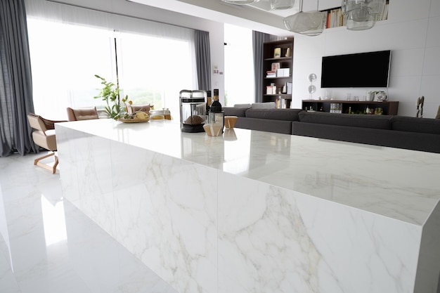 The surface of polished marble is smooth glossy and reflective It has a lustrous appearance with