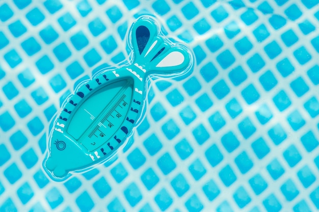 Surface of the pool, thermometer in the  water