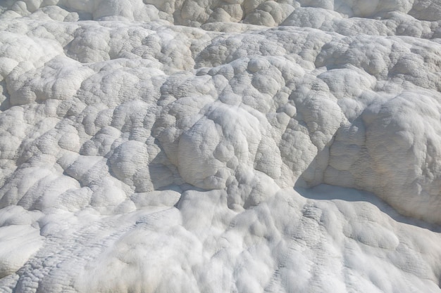 The surface of the shimmering snowwhite limestone shaped over millennia by calciterich springs