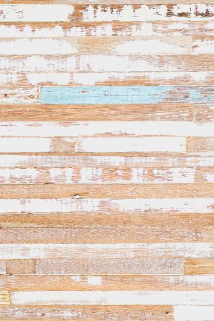 The surface of weathered painted wood