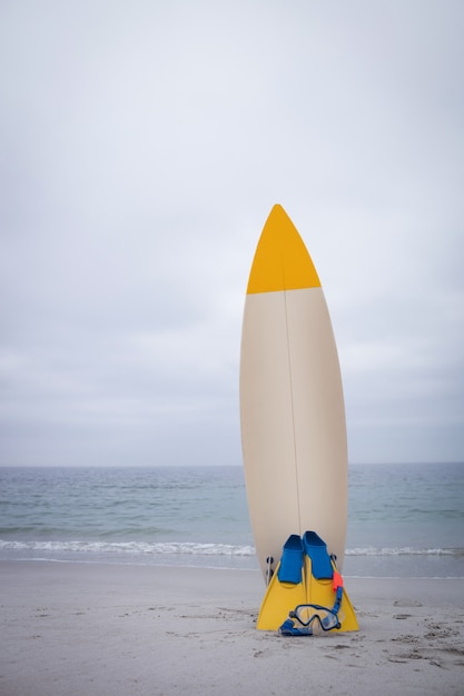 Surfboard with flippers and scuba mask