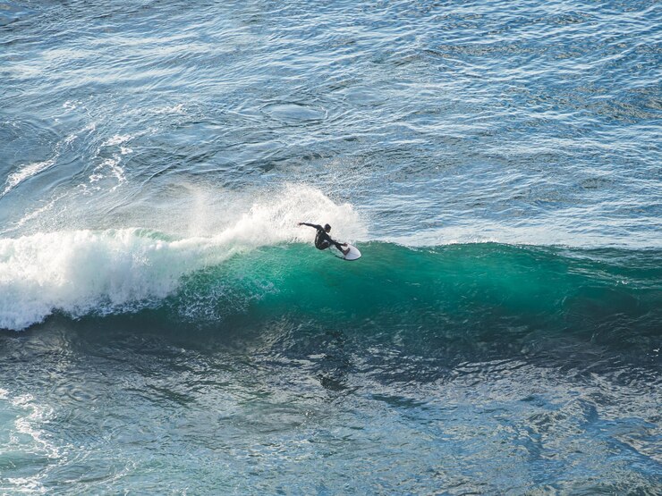 Surfer catching a wave on the north coast of Tenerife