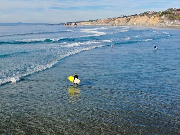 Surfers in the water at the beach