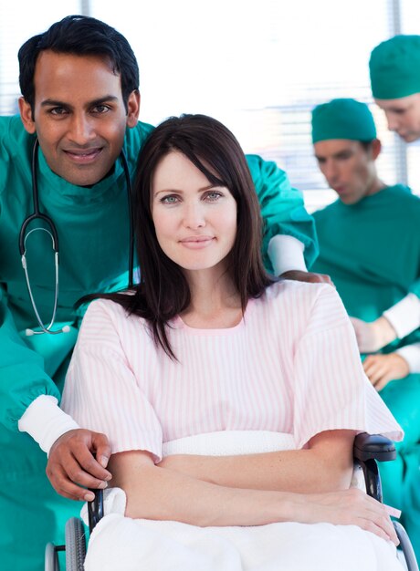 Surgeon carrying a female patient for a surgery 