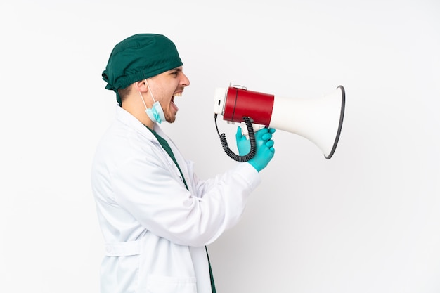 Surgeon in green uniform over isolated