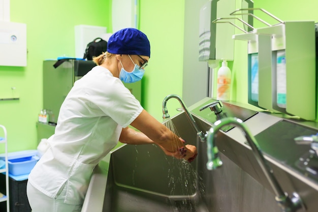 Surgeon in the hospital washing hands