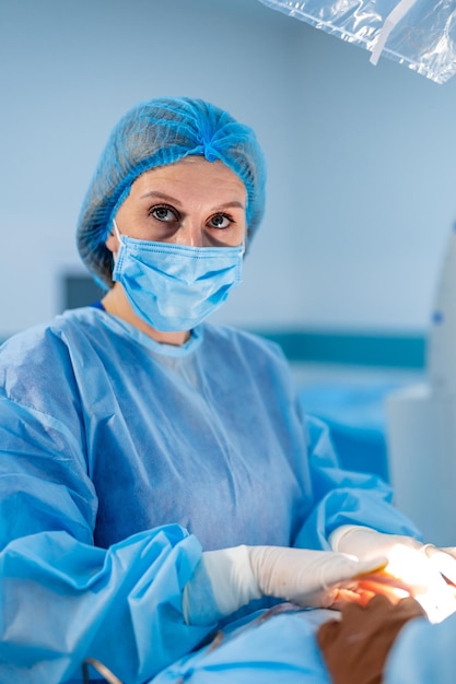 Surgeon in operating room with surgery equipment Medical team performing operation