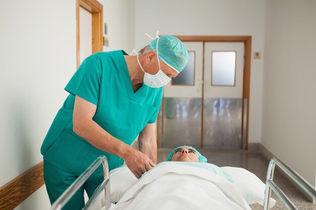 Surgeon next to a patient