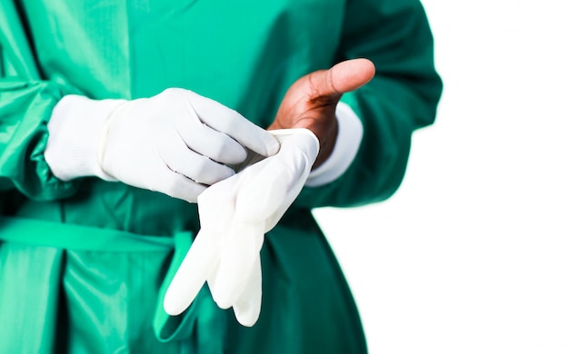 Surgeon putting on his gloves