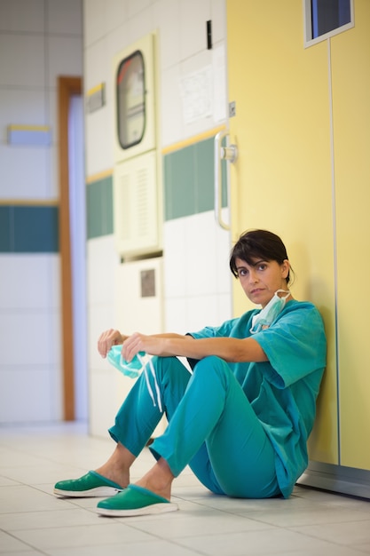 Surgeon sitting on the floor