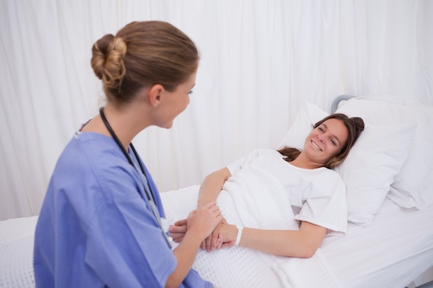 Surgeon visiting her patient