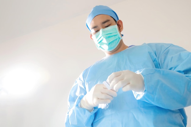 surgeon with surgical mask in Hospital Operating Theater.