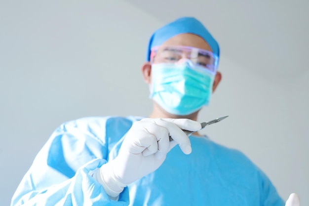 surgeon with surgical mask in Hospital Operating Theater.