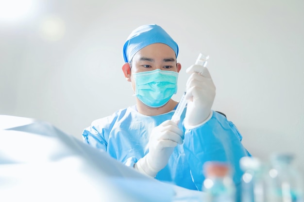 Surgeon with surgical mask in hospital operating theater.