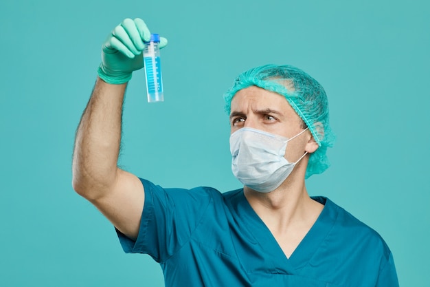 Surgeon working with test tube