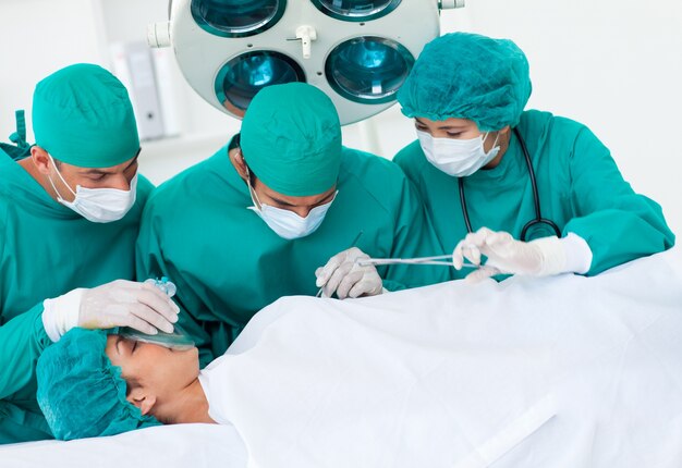 Surgeons near patient lying on an operating table