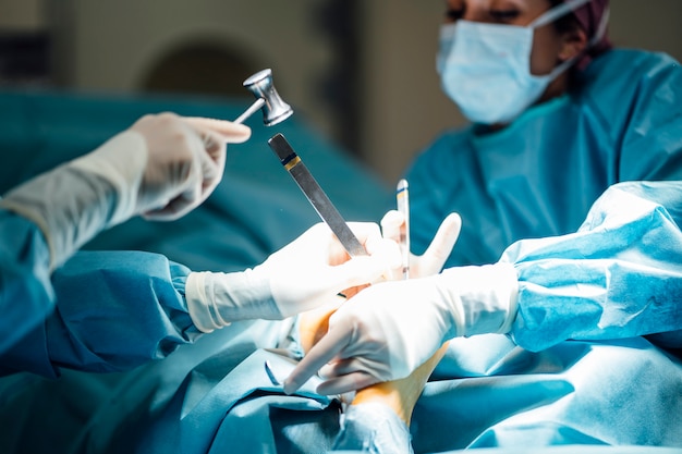 Surgeons and nurse during a surgery