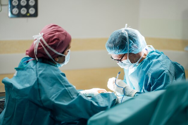 Surgeons and nurse during a surgery