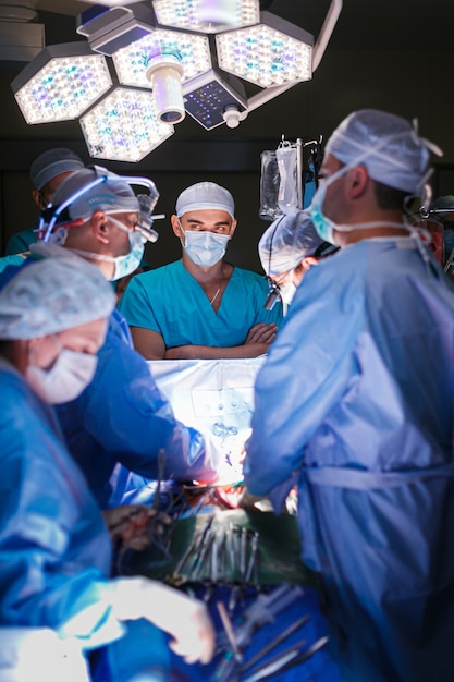 Surgeons in the operating room with a patient